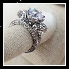 a diamond ring sitting on top of a napkin