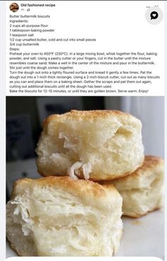 two pieces of bread sitting on top of a white counter next to an article about how to make buttered biscuits