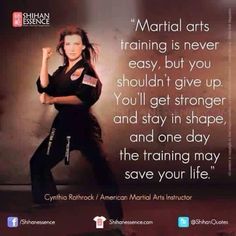 a woman is doing karate in front of a wall with the quote martial arts training is never easy, but you shouldn't give up