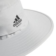 Adidas Wide-Brim Golf Sun Hat Throw some shade on your game. This adidas golf hat has a wide brim to keep the sun's rays off your face and neck while moisture-absorbing AEROREADY keeps you dry. Adjust the drawcord when a breeze comes up, and swing for the pin. Made with recycled content generated from production waste, e.g. cutting scraps, and post-consumer household waste to avoid the larger environmental impact of producing virgin content. Features & Details: One-size-fits-most Moisture-absorb Golf Socks Women, Womens Golf Skirts, Golf Pants Women, Golf Shorts Women, Womens Golf Shirts, Golf Putters, Household Waste, Golf Hat, Golf Shoes Mens