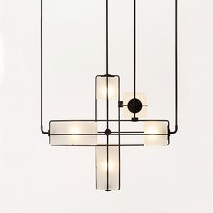 a black chandelier with five lights hanging from it's sides and four bars on each end