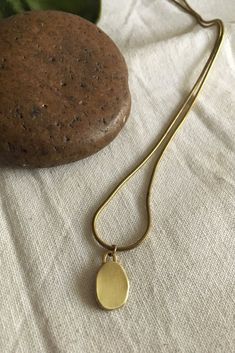 Hasaa Minor Pendant Modern brass jewelry Minimalist Brass Teardrop Pendant Necklace, Minimalist Brass Jewelry With Large Pendant, Brass Box Chain Necklace With Round Pendant, Brass Charm Necklace With Large Round Pendant, Brass Teardrop Pendant Necklace With Adjustable Chain, Everyday Necklace With Large Oval Pendant, Modern Brass Pendant Necklace, Minimalist Metal Drop Pendant Necklace, Minimalist Brass Necklace With Oval Pendant