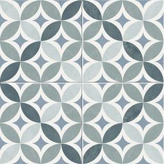 a blue and white tile pattern with circles on the bottom, in three different colors