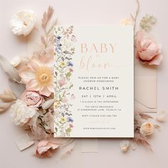 a baby shower is shown with flowers around it