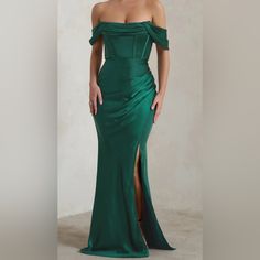 Elevate Your Evening With This Luxurious Bottle Green Bardot Fishtail Satin Maxi Dress. Crafted From Premium Satin Fabric, This Dress Exudes Sophistication And Elegance With Its Impeccable Design Details. Key Features: Color: Bottle Green Fabric: Premium Satin Neckline: Bardot (Off-Shoulder) Sleeves: Off-Shoulder Sleeves Corset: Structured For A Flattering Fit Closure: Invisible Zip Closure For Seamless Finish Detailing: Drape Detailing For Added Elegance Skirt: Fishtail Silhouette For Dramatic Flair Length: Hemmed To Fit Heights From 5'1" To 5'4" Alterations: Savings Of $80 On Cost Of Alterations Condition: Condition: Worn Once For Event, Has A Few Watermarks (See Photos For Details). S Fishtail Skirt, Satin Maxi, Satin Maxi Dress, Bottle Green, Invisible Zip, Green Fabric, Satin Fabric, Shoulder Sleeve, Design Details