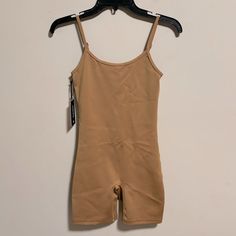 Nwt Tna Aritzia Tnagloss Rhythm 7" Romper In Caramelized Brown Size Small Brand New With Tags- Never Worn. No Flaws. This Is A Scoop-Neck Romper With Adjustable Straps. It’s Made With Tnagloss A Contouring, Body-Hugging Fabric With A Luxe Sheen And Sleek Feel Features High-Visibility Spiro Materials & Care Content: 85% Nylon, 15% Elastane Care: Machine Wash Imported Fit: Tight A Close Fit That Hugs The Body Length: 7" Intended To Hit Around Lower Thigh Model Is 5'7"/170cm Wearing A Size S Aritzia Jumpsuit, Silk Romper, Silk Jumpsuit, Aritzia Pants, Wrap Romper, Seersucker Pants, White Halter Maxi Dress, People Shopping, Pleated Mini Skirt