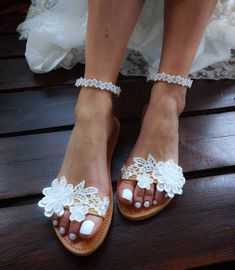 These beautiful wedding sandals are the perfect touch to beautify your wedding day!Are decorated with a white cotton trims and floral motifs They are finished with an adjustable bunkle strap for a secure and comfortable fit. FULL SIZE ONLY: ** If you have half the size, go UP to the nearest full size Check out our other wedding sandals here: WEDDING SANDALS WITH FLOWERS : https://www.etsy.com/listing/733048299/wedding-sandals-barefoot-sandals-bridal?ref=shop_home_active_7&pro=1&frs=1 htt Summer Wedding Open Toe Shoes, Flat Sandals For Spring Wedding, White Round Toe Sandals For Wedding, White Round Toe Wedding Sandals, Elegant Barefoot Sandals For Spring Wedding, Summer Bridal Accessories For Bridal Shower, Wedding Shoes With Single Toe Strap, White Round Toe Wedding Shoes For Destination Wedding, Summer White Bridal Accessories For Bridal Shower