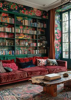 a living room filled with lots of bookshelves covered in colorful wallpapers