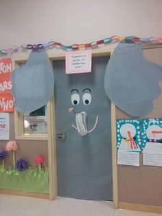 an elephant door decorated with paper plates and some decorations on the front entrance to a classroom