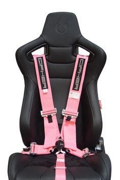 the back view of a car seat with pink harnesses and black leather upholster