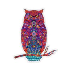 an owl is sitting on top of a sticker with colorful patterns and colors, it's eyes are open