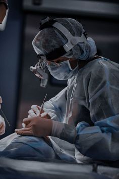 two doctors performing surgery in an operating room