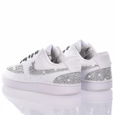 Nike Swarovski Priv Silver is the most desired women's custom sneaker ever! Super sparkling effect thanks to the swarovski applied totally by hand, which cover the toe, heel and swoosh. The laces in black and laminated silver weave further emphasize the brightness of this sneaker, it will be impossible to go unnoticed with them on your feet. Nike Swarovski Priv Silver will also come with its original white laces. This item is a special and exclusive piece, the result of research and craftsm Luxury White Custom Sneakers With Rhinestones, Luxury Sneakers With Rhinestones And Round Toe, Silver Bedazzled Low-top Sneakers, Luxury White Sneakers With Rhinestones, Luxury Embellished Sneakers For Streetwear, Luxury Bedazzled White Sneakers, Luxury Bedazzled Low-top Sneakers, Luxury Custom Sneakers With Rhinestones And Round Toe, Luxury Bedazzled Round Toe Sneakers