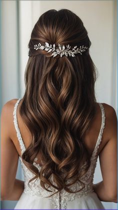 the back of a woman's head wearing a bridal hair comb