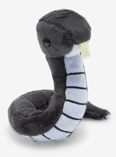 a stuffed snake is sitting on the ground