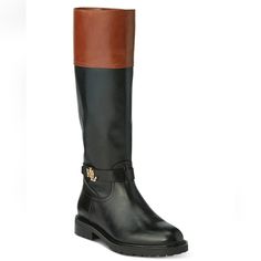 Item: Lauren Ralph Lauren Women's Leather Everly Riding Boot Black/Tan Calf 6b New Size: 6b Features: -Lauren Ralph Lauren Everly Riding Boot -Two-Tone Upper -Metal Logo Hardware At The Ankle -Rounded Toe -Inside Zip Closure -Textile Lining And Synthetic Insole -Man-Made Lug Sole Provides Traction Condition: New With Defect Sorced From A Shoe Bin. May Have Slight Scuffs Measurements: Heel: 1.5" Platform: .5" Let Us Know If You Have Any Questions! Classic Brown Boots With Leather Trim, Brown Leather Trim Boots For Fall, Brown Flat Heel Boots For Office, Elegant Brown Boots With Leather Footbed, Elegant Black Boots With Leather Footbed, Brown Calf Leather Boots With Flat Heel, Leather Trim Round Toe Boots For Work, Black Leather Boots With Leather Trim, Leather Trim Round Toe Work Boots