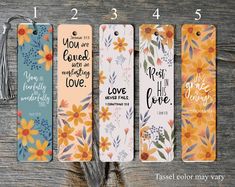 four bookmarks with bible verses on them, one has flowers and the other has words