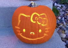 two pumpkins that have been carved to look like hello kitty