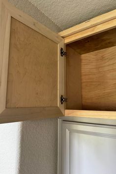 an open cabinet door in a room