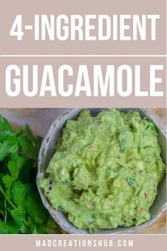 a bowl filled with guacamole next to cilantro