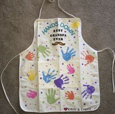 a child's apron with handprints on it