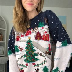 a woman wearing an ugly ugly christmas sweater