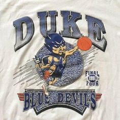 a white shirt with blue devil's logo on the chest and an image of a basketball