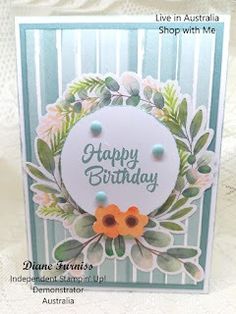 a happy birthday card with flowers and leaves