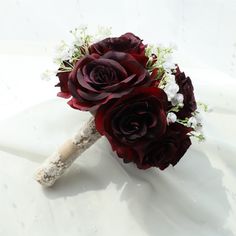 the bridal bouquet is made up of red roses