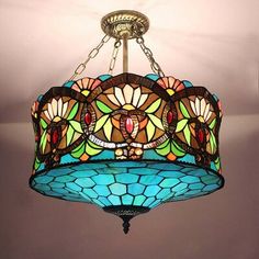 a stained glass chandelier hanging from the ceiling