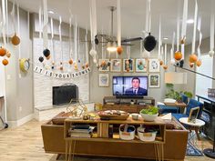 a living room filled with furniture and hanging decorations