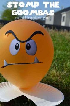 a balloon with an angry face on it and the words stop the goombas