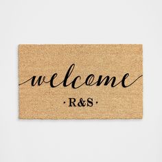 a welcome mat with the words r & s written in cursive writing on it