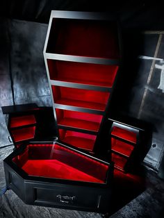 a black and red display case sitting on top of a floor