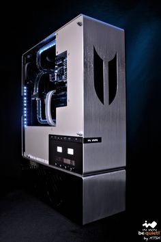 a silver and black computer case in the dark