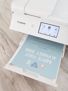 a white printer sitting on top of a table