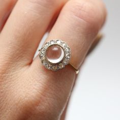 I'm selling a few pieces of my personal collection as they aren't getting enough wear and I want someone else to enjoy them. This is a lovely Victorian era piece, an 8mm rock crystal cabochon surrounded by a halo of rose cut diamonds, set in 18k yellow gold topped with platinum. Ring face measures 13mm in diameter, ring size 5. Sizing available Layaway available Rosecut Diamond Ring, Bow Ring, Crystal Diamond, Gold Top, Platinum Ring, Rock Crystal, Rose Cut Diamond, Diamond Crystal, Victorian Era