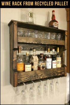 a wooden shelf filled with bottles and glasses