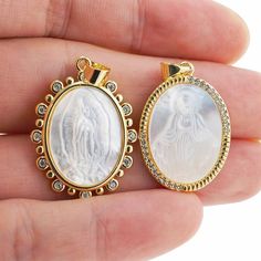 Luxury Oval Jesus Necklace Pendant Shell Pearl Jewelry Gold Brass Pave CZ Zircon Mother Of God  Charm Pendant Accessories For DIY Jewelry ☆Size: 30x16mm ☆Link Hole Size: 2.5mm ☆CZ Color: Clear ☆Metal Material: Copper / Zircon / Shell Pearl ☆Metal Finish Color: Yellow Gold,  ☆Plating：Real Gold ,Nikel free, Leadfree,Cadmium free，3 Times Fine Polishing Mirror Finish Plated , not easy to fade   Usage : Bead for bracelet, necklace or other crafts Dear guest: Thank you for entering our store. Free shipping on orders over US $ 100, orders over US $ 200 reduce US $ 10, orders over US $ 500 reduce US $ 30。 We specialize in LARGE BULK ORDERS and can offer WHOLESALE PRICING - We are located in Guangzhou, China and carry big stock for most of our listings . We ship the item to worldwide from China,so Gold Oval Rhinestone Jewelry, Gold Oval Jewelry With Rhinestones, Oval Rhinestone Jewelry Gift, Oval Shaped Rhinestone Jewelry For Gifts, White Cubic Zirconia Oval Pendant Jewelry, Jesus Necklace, Schmuck Gold, Mother Of God, Pearl Shell