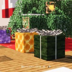 three boxes sitting on top of a wooden floor next to a green tree in minecraft