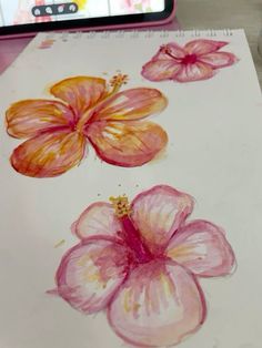 an image of flowers painted on paper with a cell phone in the backgroud