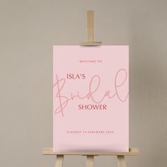 a pink sign that says, welcome to the bridal shower on an easel