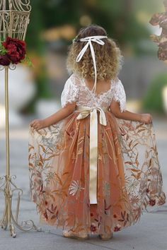 Our burnt orange floral embroidered short sleeve flower girl dress is perfect for fall or BoHo style weddings. Featuring a stunning V-shaped back with eyelash lace and ankle-length skirting, this dress suits toddlers, girls, and junior bridesmaids. Ideal for weddings, family photo shoots, or special occasions. Choose from plain, jeweled, or custom-made floral sashes. Note your sash color and custom flower preferences at checkout. Link to Matching Hair Accessories: https://www.littlekittenboutiqu Fall Flower Girl, Fall Flower Girl Dresses, Junior Bridesmaids, Long Flower Girl Dresses, Custom Sash, Boho Style Wedding, Elegant Fall, Long Sleeve Short Dress, Junior Bridesmaid