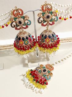 Nauratan Multi Stones Earrings Tikka Set Bohemian Tilla Earrings For Celebration, Party Chandbali Jhumkas Hand Set, Multicolor Jhumkas With Matching Earrings For Diwali, Multicolor Jhumkas For Diwali With Matching Earrings, Hand Set Chandbali Jhumkas For Party, Traditional Party Jewelry With Matching Earrings, Traditional Hand-set Jhumkas For Parties, Festive Hand Set Jhumkas For Party, Multicolor Wedding Earrings For Eid