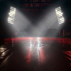 an empty stadium with bright lights shining on the floor and in the middle of it