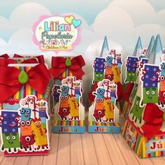 colorful party bags with red bows and monsters on them