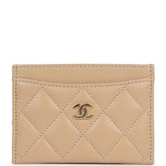 This Chanel classic quilted cardholder in beige caviar leather with gold hardware features a "CC" signature on the front, signature half-moon pocket on front and back and slit pocket behind center pouch.The center pouch is lined with beige grossgrain fabric.Collection: REVOrigin: SpainCondition: New and never wornAccompanied by: Chanel box, Chanel dustbag, carebookMeasurements: 4.25" width x 3" height x 0.25" Chanel Box, Classic Card, Celine Bags, Handbag Wallet, Carry All Bag, Wallet Accessories, Card Holder Wallet, Fendi Bags, Half Moon