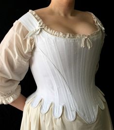 "Exemplify seventeenth century elegance in this shapely corset. This corset is rigidly boned with closely spaced 1/4\" steel bones and is cut to enhance and lift the bust, and shape the waist. The waist tabs, cut in one with the corset, curve over the hips. The shoulder straps form the high back and off the shoulder neckline, a hallmark of this period. This style is also available without tabs. Features include: Ø Side seam alteration point for an adjustable fit Ø Center back lacing Ø Shoulder s 18th Century Dress, Dress Tutorials, Period Outfit, Historical Costume, Historical Dresses, Fashion Plates, Historical Clothing, Historical Fashion, Fashion Fabric