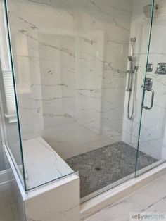 a walk in shower sitting inside of a bathroom