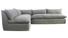 a large gray couch with pillows on the bottom and back cushions, sitting in front of a white background